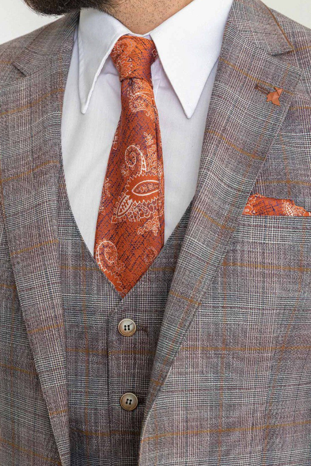 Close-up of Mazonni checkered gray suit with patterned orange tie and pocket square, elegant men's outfit