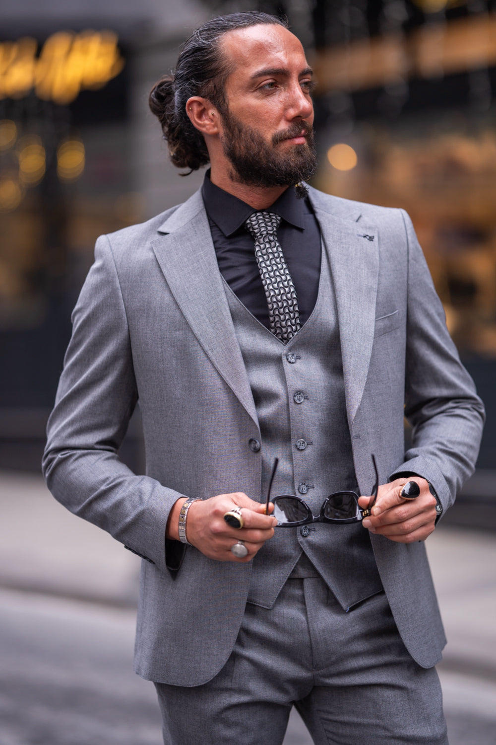 Mazonni men’s grey slim fit suit with matching waistcoat and black shirt, perfect for modern office looks