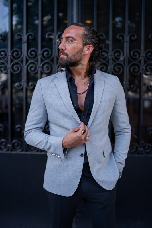 light grey blazer for men by Mazonni, styled with black shirt and pants for sleek evening outfit