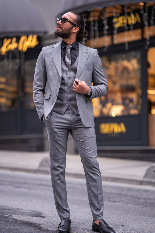Light grey three-piece suit for men by Mazonni with notch lapel jacket, ideal for business and formal events
