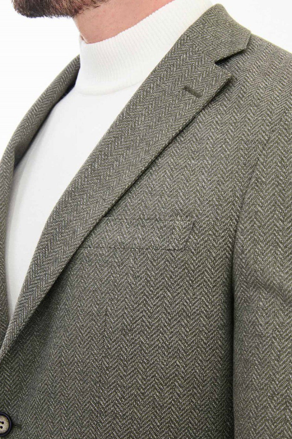 Close-up of light olive green Mazonni blazer showing subtle pattern and classic lapel – refined formal jacket for men