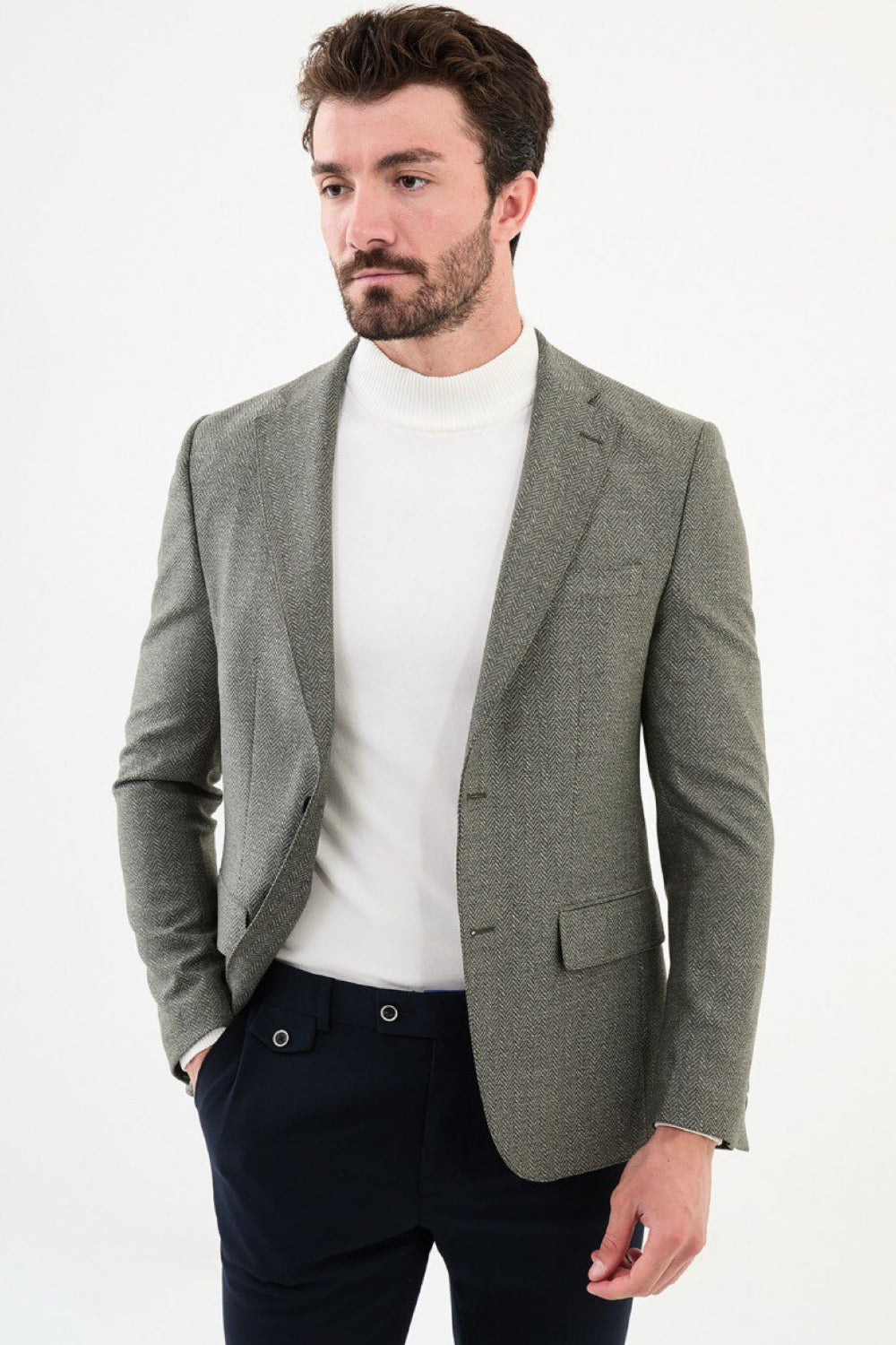 Light olive green men’s blazer by Mazonni styled with white turtleneck – elegant smart casual blazer look