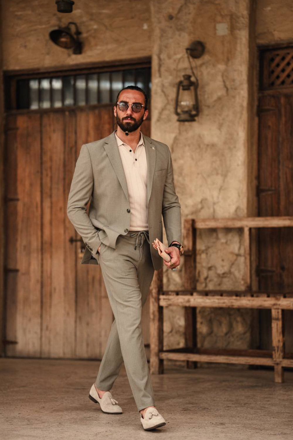 Light olive green Mazonni men's suit styled with a white polo shirt and white sneakers, perfect for modern casual business outfits