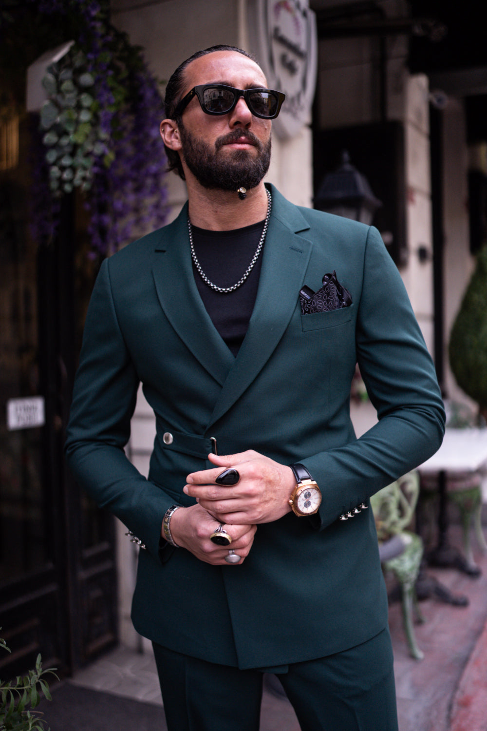 Mazonni men's green tailored suit featuring peak lapels and pocket square, styled for urban sophistication