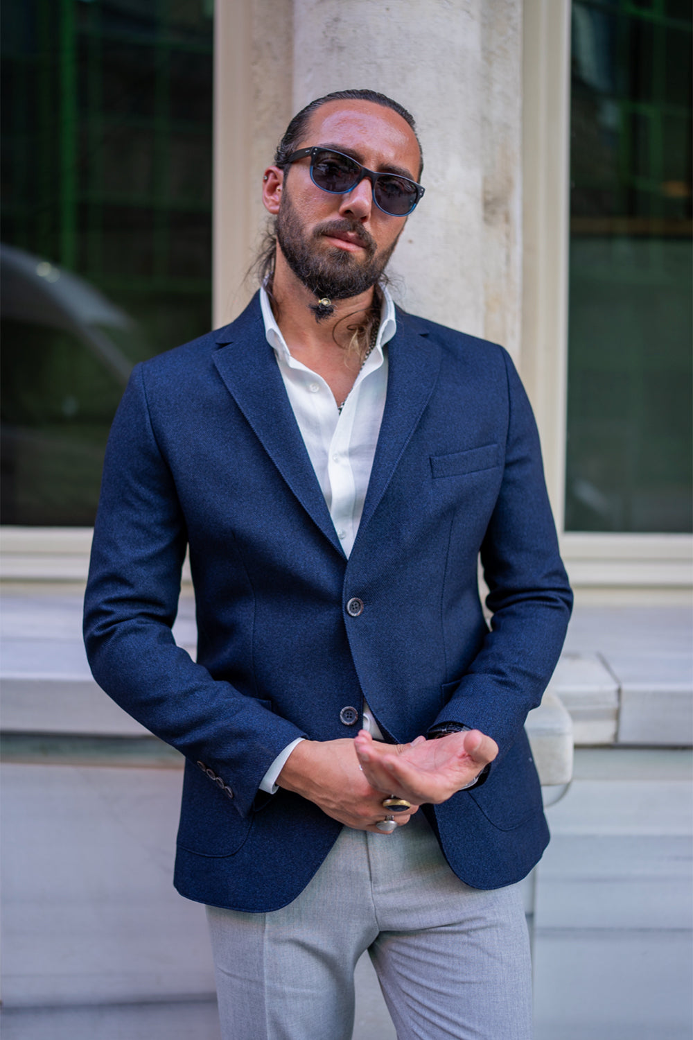 navy blue blazer for men by Mazonni, styled with light trousers and white shirt for elegant daytime look