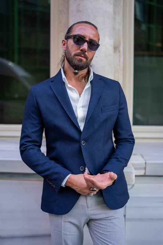 navy blue blazer for men by Mazonni, styled with light trousers and white shirt for elegant daytime look