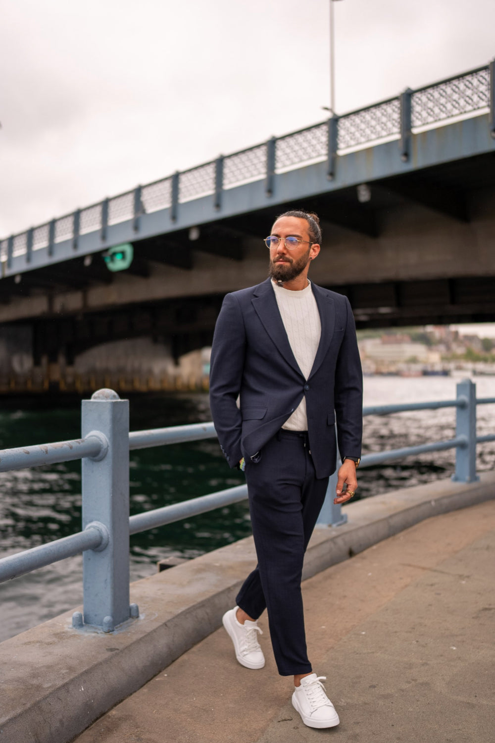 Navy blue men's suit from Mazonni styled with a white crew neck t-shirt and white sneakers, perfect smart casual outfit for a modern city look