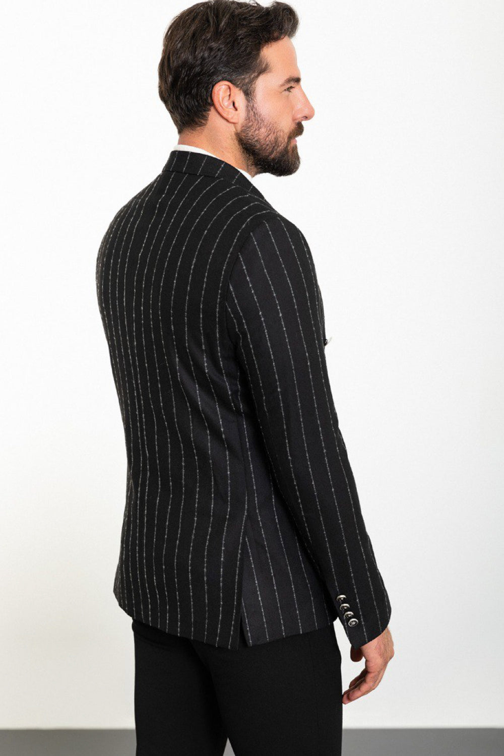 Back view of men’s black pinstriped Mazonni blazer featuring a tailored fit – perfect for professional or evening occasions