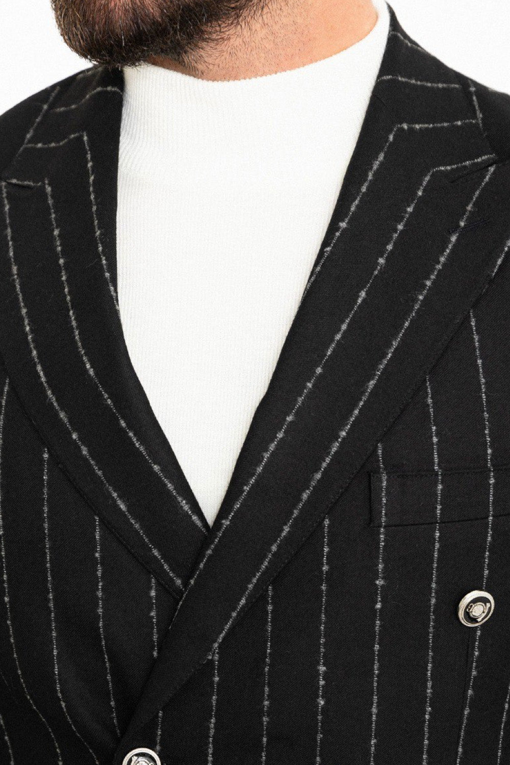 Close-up of Mazonni men’s black striped blazer with peak lapels and metallic buttons – statement piece for elegant businesswear