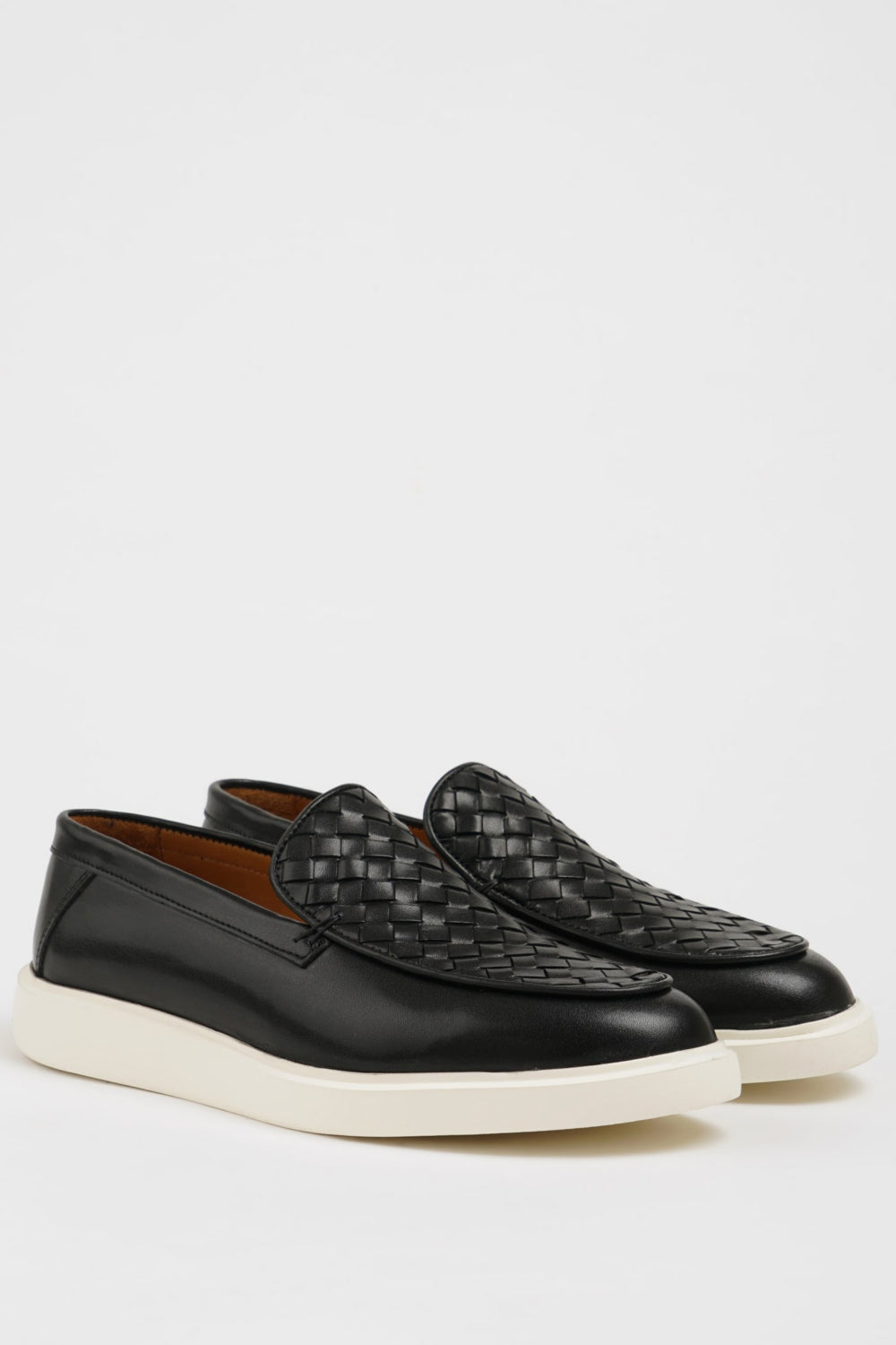 Mazonni men’s black slip-on sneakers featuring basketweave upper and contrast sole
