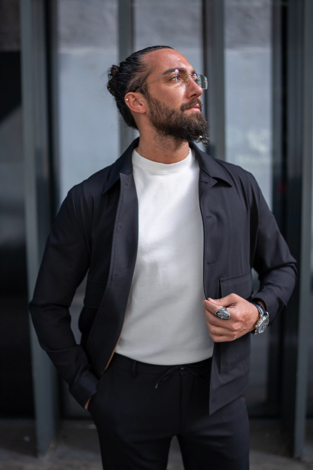 Mazonni dark suit for men with modern tailoring, paired with a basic white tee and sporty watch
