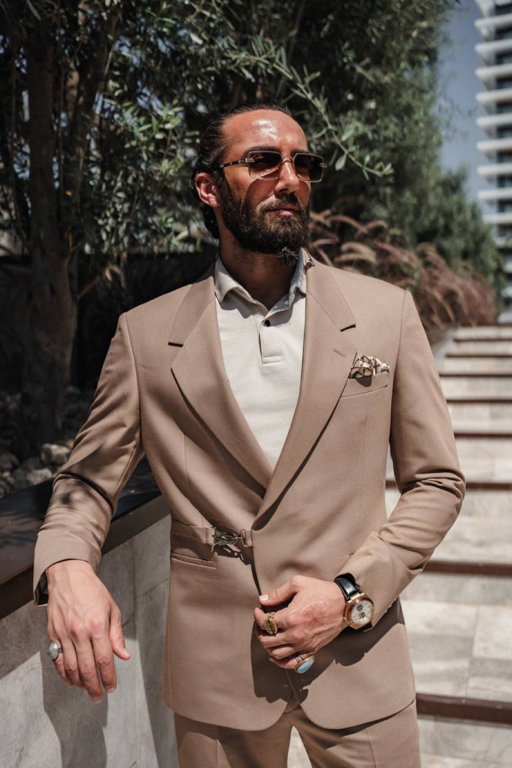 Beige Mazonni men's suit styled with a neutral shirt and sunglasses, perfect for sophisticated summer business looks