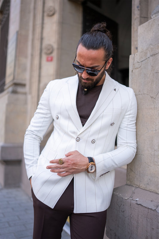 off white double breasted blazer for men by Mazonni paired with brown trousers, stylish contrast outfit for city wear