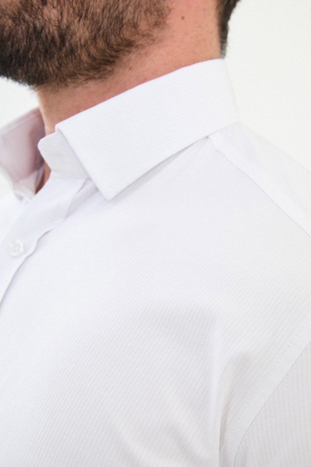 Stylish white formal shirt for men by Mazonni, textured fabric with button-down front and tapered fit