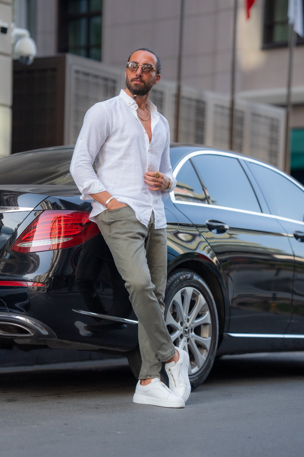 Classic long sleeve white shirt by Mazonni styled with olive pants for a modern look