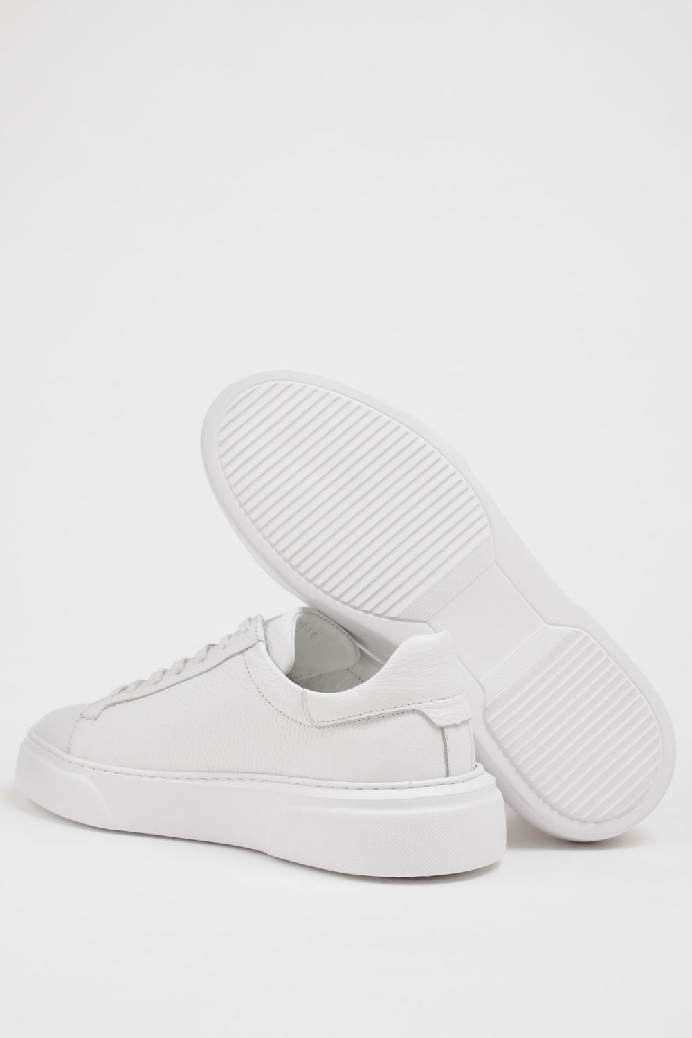Sleek white casual sneakers from Mazonni designed for everyday wear and modern street style