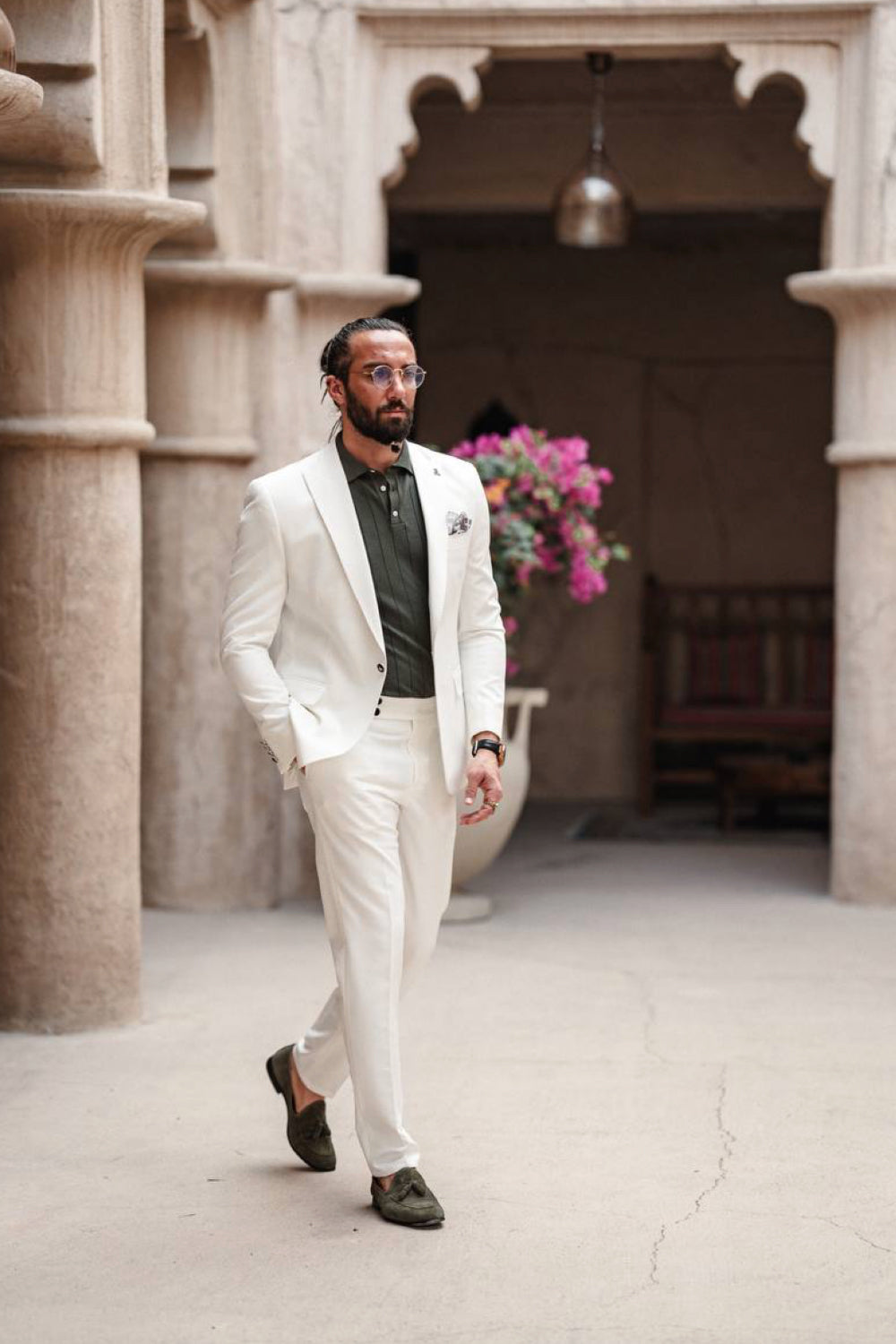 Elegant white Mazonni suit for men paired with an olive green shirt and dark loafers, ideal for wedding or summer event looks
