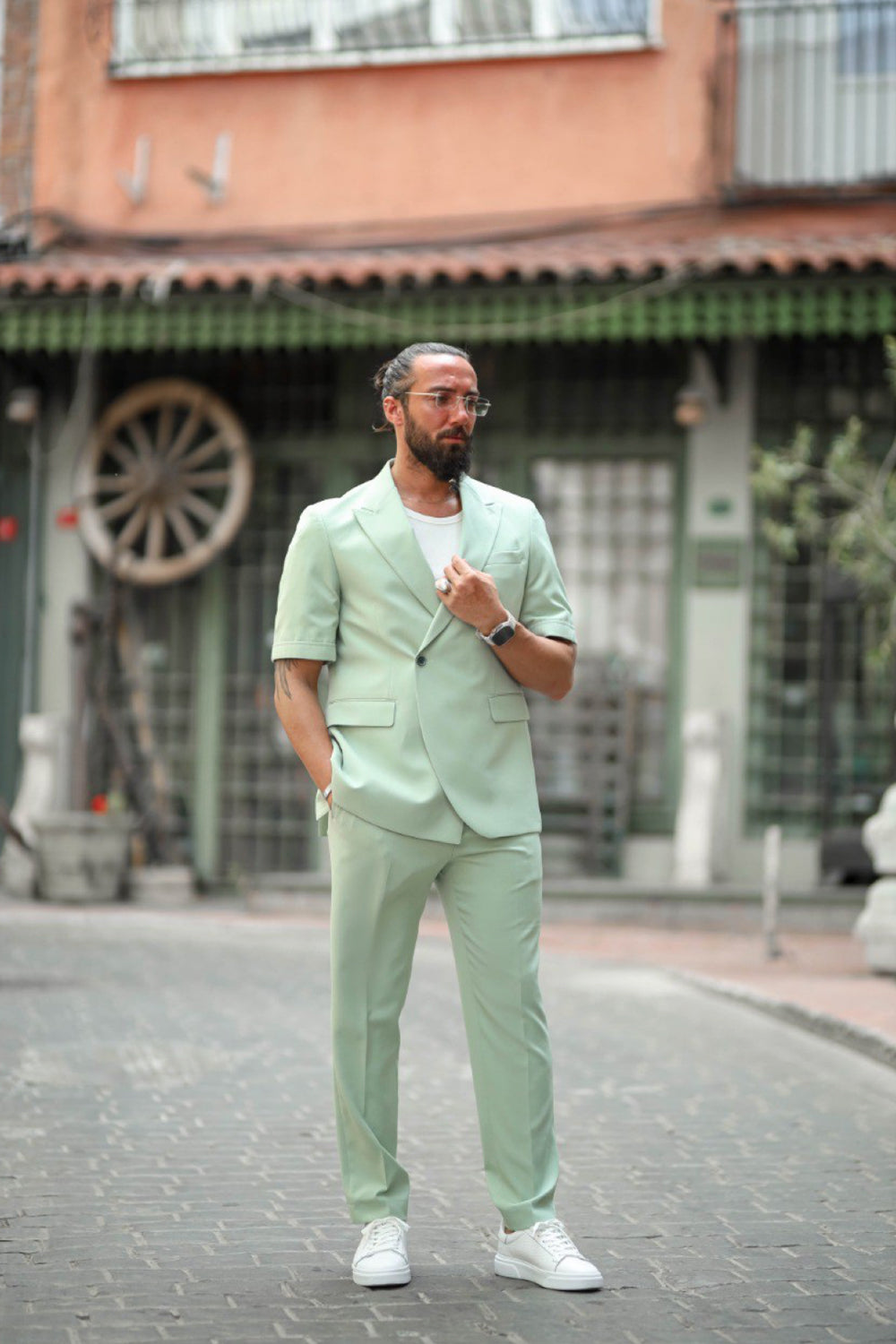 Fashionable mint green two piece suit for men with relaxed tailored fit